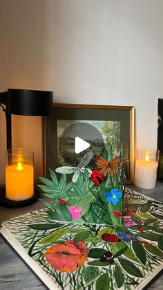 a table topped with candles and pictures on top of it