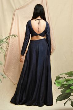 Navy blue blouse with bead embroidery and back tassel tie-up. Paired with raw silk lehenga.
Component: 2
Pattern: Embroidered
Neckline: Round
Sleeve Type: Full
Fabric: Plant based raw silk
Color: Blue
Other Details: 
Back tassel tie-up
Closure: Zipper
Occasion: Wedding - Aza Fashions Party Dress With Unstitched Blouse In Raw Silk, Festive Silk Dress With Back Tassel Tie-up, Traditional Blouse Piece With Back Yoke For Party, Traditional Party Blouse With Back Yoke, Fitted Wedding Sets With Tassels, Wedding Sets With Tassels And Fitted Design, Elegant Festive Sets With Back Tassel Tie-up, Elegant Festive Dress With Back Tassel Tie-up, Traditional Wedding Dress With Back Tassel Tie-up