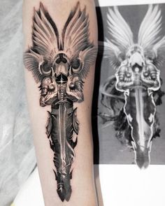 a black and white photo of a cross with wings on its arm, next to a tattoo design