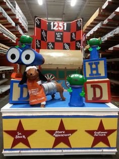 an inflatable display at a toy store with characters on it and stars around the edges