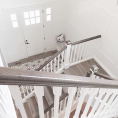 the stairs in this house are white and wood