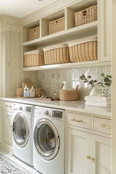 a washer and dryer in a white laundry room with baskets on the wall