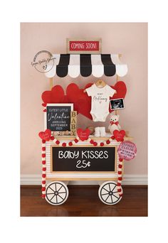 a baby's first birthday cake cart with teddy bears and heart shaped balloons on top