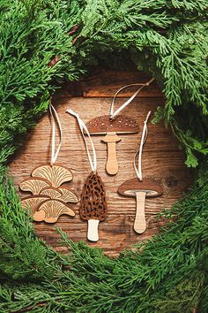 an assortment of wooden mushrooms are arranged in a wreath