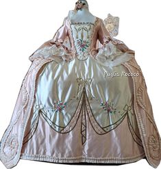 Elegant Beige Costume Dress, Elegant Pink Costume Dress, Elegant Pink Costume Gown, Elegant Pink Gown For Costume, Elegant Pink Gown With Intricate Embroidery, Pink Historical Costume Dress, Historical Costume Design Pink Dress, Pink Costume Dress With Historical Design, Historical Costume Dress In Pink