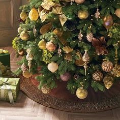 a decorated christmas tree with presents under it