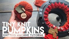 someone is holding two knitted pumpkins in front of a machine with the words tiny knit pumpkins on it