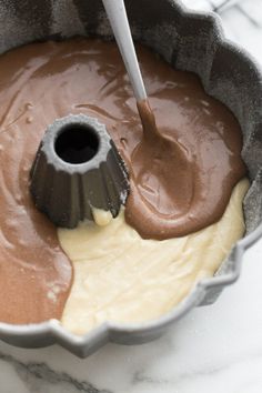 a cake pan filled with batter and chocolate