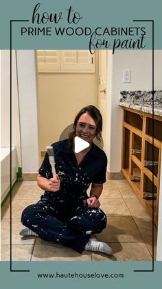 a woman sitting on the floor in front of a mirror with text overlay that reads how to prime wood cabinets for paint