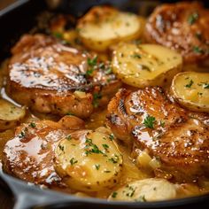 some meat and potatoes are cooking in a skillet