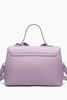 Effortlessly chic, the Jasmine Bowtie Crossbody Purple Bag is the perfect compact size that exudes modern elegance. Gold tips and ornaments with functional compartments to aid in a day of exploring the city or a classic dinner date. - 9 3/4"W x 7"H x 5"D - Luxurious Vegan Leather - Top handle drop: 4'' - Strap: 23" Adjustable/Detachable - Magnetic snap and zipper - 1 inner compartment divider, 1 inner zipper pocket Purple Bag, Gold Tips, Hair Accessories Gift, Dinner Date, Modern Elegance, 7 H, Leather Top, Long Tops, Short Tops