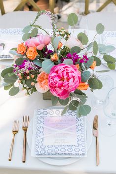 an image of a table setting with flowers and place settings on pinterest page