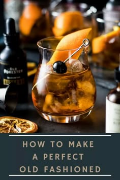 an old fashioned drink in a glass with orange peels