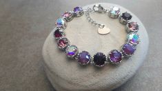 "Handmade Art Deco Style \"Glow Amethyst\" Filigree Platinum Bracelet with Stainless Steel Chain and Findings - made with Genuine Multi-color Amethyst/Aurora Borealis Elements.  Great Sparkle Perfect for Bridesmaid gift too ** Length: 6\" plus 2\" chain extender bracelet . Helpful tips for proper care: To avoid damaging or dulling Costume Jewelry, do not use jewelry cleaner or soak the jewelry in water. When dressing, I could recommend that you put jewelry on last in order to avoid the damaging Adjustable Purple Bracelet For Anniversary, Purple Round Bracelets For Anniversary, Adjustable Purple Bracelets For Anniversary, Purple Round Crystal Party Bracelet, Purple Bracelet Jewelry For Party, Purple Crystal Bracelet For Party, Elegant Multicolor Bracelets For Birthday, Elegant Handmade Crystal Bracelet For Birthday, Platinum Bracelet