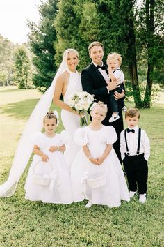 a bride and groom with their four children