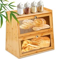 an image of bread on display in a wooden case with spices and seasoning bottles