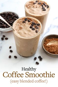 two glasses filled with coffee smoothie on top of a table