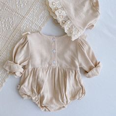 100% cotton Vingage style Comes with a matching bonnet Sizing runs true to size Cream Cotton Bubble Romper For Playtime, Cream Cotton Playtime Bubble Romper, Cute Cream Cotton Bubble Romper, Cream Long Sleeve Bubble Romper For Summer, Cute Beige Cotton Bubble Romper, Fitted Long Sleeve Cotton Bubble Romper, Spring Cotton Bubble Romper With Lace Trim, Spring Rompers