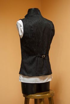 Stylish double-breasted men's black vest made of high-quality jacquard with viscose lining. Lapels and collar - from cotton velvet. Decorated with dark silver buttons. The waist can be adjusted from the back. The collar can be worn as a stand or as a turn-down. Will be perfect for victorian or vampire wedding, photoset, also it could be worn as a part of a historical costume. The vest is made to order. Please, tell us the following measurements: - Height - Chest - Waist - Hips ♥ See all costumes Victorian Vest, Mens Black Vest, Vampire Wedding, Wedding Gothic, Victorian Style Wedding, Edwardian Costumes, Steampunk Vest, Elven Dress, Ren Faire Costume