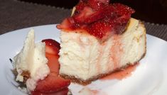 a piece of cheesecake with strawberries on top