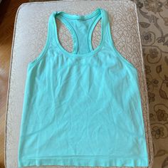 Lululemon Swiftly Cropped Racerback Tank. Never Worn. Mint Green. Cheap Disney Green T-shirt, Green Racerback Top For Light Exercise, Green Racerback Tank Top For Light Exercise, Lululemon Clothes, Gazelle Outfit, Adidas Gazelle Outfit, Preppy Closet, Anna Claire, Air Port