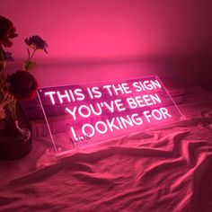 a neon sign that says, this is the sign you've been looking for