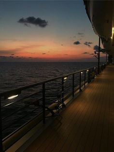 the deck of a cruise ship at sunset