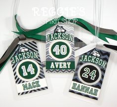 three tags with the number forty and two for each team are hanging from a ribbon