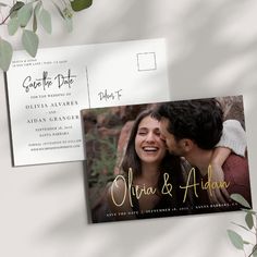 a wedding save the date postcard with an image of a man and woman kissing