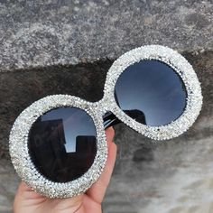 Glamorous Rhinestone-Embellished Oversized Round Sunglasses Elevate your style with our Oversized Round Diamond Sunglasses. Adorned with glittering rhinestones, these sunglasses exude a glamorous and fashionable look. Make a Statement With their punk-inspired design, these shades add a touch of luxury to any outfit. Whether you're dressing up or down, stand out from the crowd and embrace high-end fashion. Key Features Frame Material: Plastic Lenses Material: Polycarbonate Optical Attribute: UV40 Female Sunglasses, Round Lens Sunglasses, Retro Eyewear, Oversized Round Sunglasses, Casual Rings, Rhinestone Sunglasses, Steampunk Sunglasses, Round Sunglasses Women, Party Sunglasses