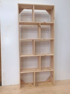 a wooden shelf with several shelves on it