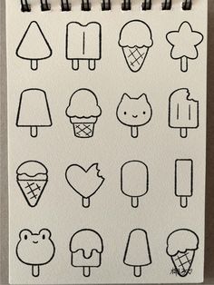 a drawing of different kinds of ice creams on a piece of paper with markers