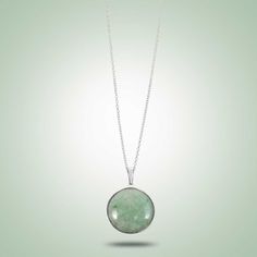 Sleek and elegant circle pendant, enhanced simplistically by a silver bezel. Mint Green Jade Sterling Silver (925) Length Pendant: 1.1" Length Chain: 18" Available in different Jade colors, on request Modern Round Cabochon Necklace, Modern Cabochon Necklace, Green Necklaces With Bezel Setting, Minimalist Round Cabochon Necklaces, Minimalist Round Cabochon Necklace, Modern Sterling Silver Necklace With Bezel Setting, Sterling Silver Cabochon Round Necklace, Sterling Silver Round Cabochon Necklace, Minimalist Round Necklace With Smooth Bezel