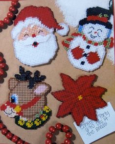 cross stitch christmas decorations with santa and snowmen