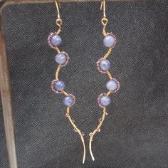 Purple Jade Wire Wrapped With Light Amethyst On Gold Plated Wire To Create These Elegant Unique Earrings. Adjustable Lavender Jewelry With Matching Earrings, Purple Wire Wrapped Jewelry For Party, Elegant Purple Wire Wrapped Jewelry, Party Purple Wire Wrapped Jewelry, Party Wire Wrapped Purple Jewelry, Handmade Adjustable Lavender Earrings, Unique Purple Earrings With Ear Wire, Adjustable Purple Earrings With Natural Stones, Purple Wire Wrapped Drop Beaded Earrings