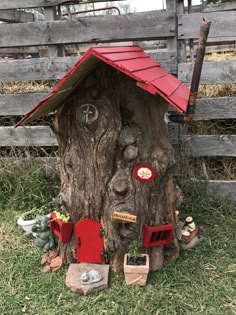 a tree stump with a house built into it