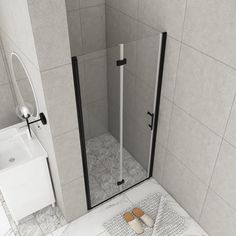 a walk in shower sitting next to a white sink and toilet on top of a tiled floor