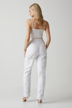 Introducing our Premium Embellished Jacquard Trousers, a stunning addition to your wardrobe. These white pants are meticulously embellished with intricate gold and silver details, adding a touch of elegance and sophistication to any outfit. Crafted with the utmost care and attention to detail, these trousers are designed to make a statement and elevate your style. Perfect for special occasions, these trousers are a must-have for those who appreciate exquisite craftsmanship and timeless beauty. Bridal Separates, Tapered Trousers, White Pants, Fashion Face, Elevate Your Style, Gold And Silver, Timeless Beauty, Special Occasion, Fashion Beauty