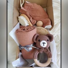 a teddy bear and other items in a box