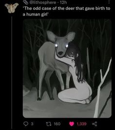 a woman kneeling down next to a deer with glowing eyes on it's face