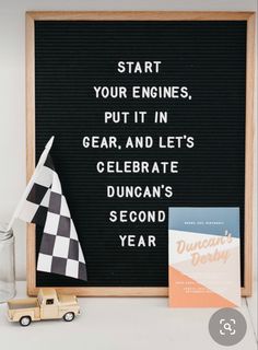 a sign that says start your engines put it in gear and lets celebrate duncan's second year