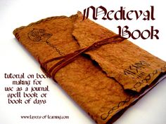 an open book with writing on it and brown paper wrapped in twine to the cover