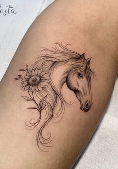 a horse and sunflower tattoo on the leg