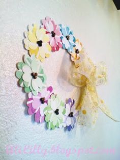 a bunch of flowers that are sitting on a white table cloth with some scissors in it