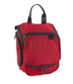 a red lunch bag with zippers on the side