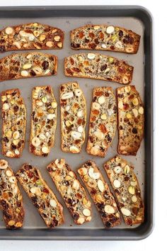 several slices of bread with nuts and other toppings