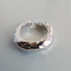 WELCOME to My Gallery, where you can find, handmade contemporary art jewelry, for you and your loved one -Dome ring -Textured Ring -Statement ring, cute Ring -Handmade Rings -Solid Silver -Carved out of wax, no two rings are alike, and the outcome is a unique organic form. -High-Quality Solid 925 Sterling Silver -Polished finish -Custom made - Men and women ring - Pinky ring 💍 Ring size conversion chart can be found in the picture section 💍 -Ring for both everyday wear and special occasions -M Modern Handmade Stackable Rings With Open Band, Modern Handmade Stackable Rings For Anniversary, Modern Handmade Stackable Open Band Rings, Modern Handmade Stackable Rings For Everyday, Minimalist Hand Forged Open Midi Rings, Minimalist Hand Cast Ring, Contemporary Rings With Unique Design For Gift, Minimalist Hand Cast Rings As A Gift, Unique Open Midi Rings For Everyday