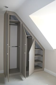 an open closet in the corner of a room