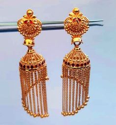 22k Gold Jhumkas-Indian Gold Jhumka-Solid Gold Jhumka-Indian Karigari Gold Jhumka-Dangling Gold Chain jhumkas-Solid Gold Earrings This is beautifully handcrafted design of Dangling Gold Jhumkas in 22k Solid Gold which is designed with Solid Gold dangling Chains that gives it the classy and eye catchy look ! PRODUCT SPECIFICATIONS: Material: 22k Solid Gold Weight : 16.50 approx Customer Satisfaction is our utmost priority, feel free to have any query, would love to hear from you ! Jai Shree Shyam Luxury 22k Gold Traditional Chandbalis, Luxury 22k Gold Elegant Chandbalis, Navratri Gold Danglers With Cutdana, Gold Chandbalis With Latkans For Navratri, Gold Cutdana Danglers For Navratri, Navratri Gold Cutdana Danglers, Festive Gold Chandbalis With Latkans, Gold Jhumkas With Tilla For Navratri, Gold Jhumkas For Navratri Puja