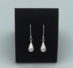 These classic sterling silver drops are offered with either my handmade ear wires or leverbacks depending on what look you prefer.  The earwires are made from Argentium sterling silver and the leverbacks are purchased from RioGrande out of New Mexico in the USA.  These gorgeous earrings make a great gift for all generations and will fall 1.5 inches from your piercing. Sleek, pretty, and polished to a high shine they are a lovely accessory to any ensemble from the morning to late night fun! Shoul Nickel-free Classic Teardrop Earrings For Anniversary, Classic Teardrop Earrings With French Hook For Gift, Classic Teardrop Earrings With Lever Back, Classic Nickel-free Teardrop Earrings As Gift, Classic Silver Teardrop Earrings Gift, Sterling Silver Drop Earrings For Everyday, Everyday Sterling Silver Drop Earrings, Silver French Hook Earrings For Everyday, Classic Teardrop Dangle Earrings For Gift